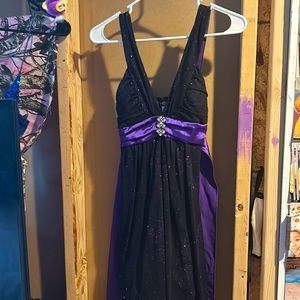 Beautiful black and purple dress! Bought it for hoco, was never worn!